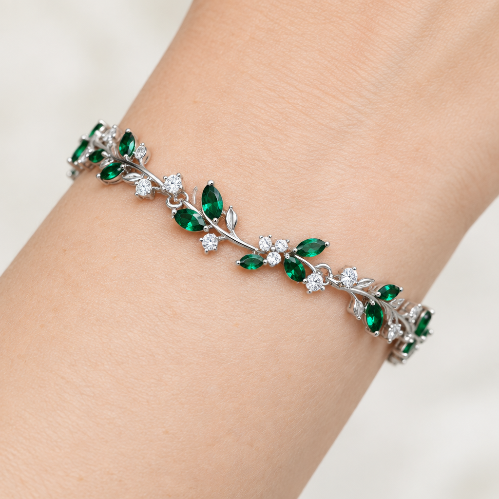 Macro close-up of a green stone botanical bracelet on a woman's wrist at a diagonal angle