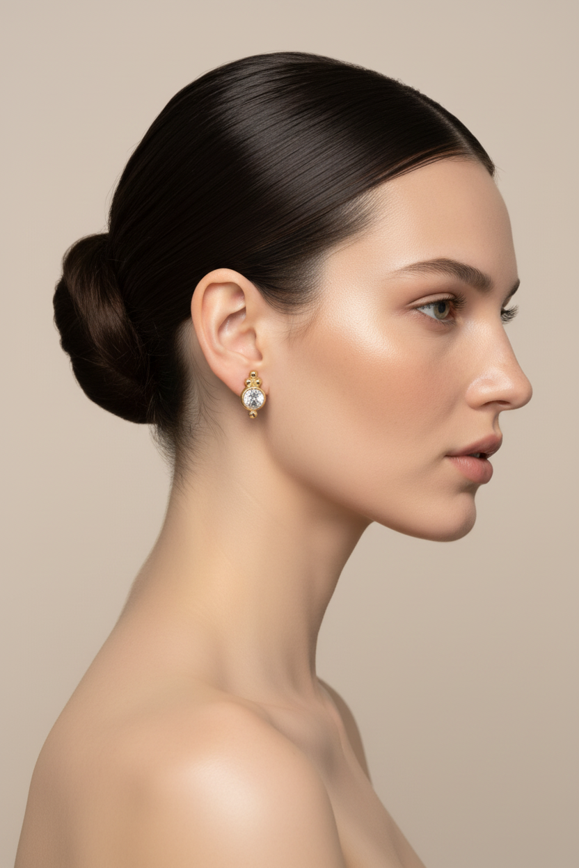 Woman right profile, ballerina bun, gold crystal oval earring