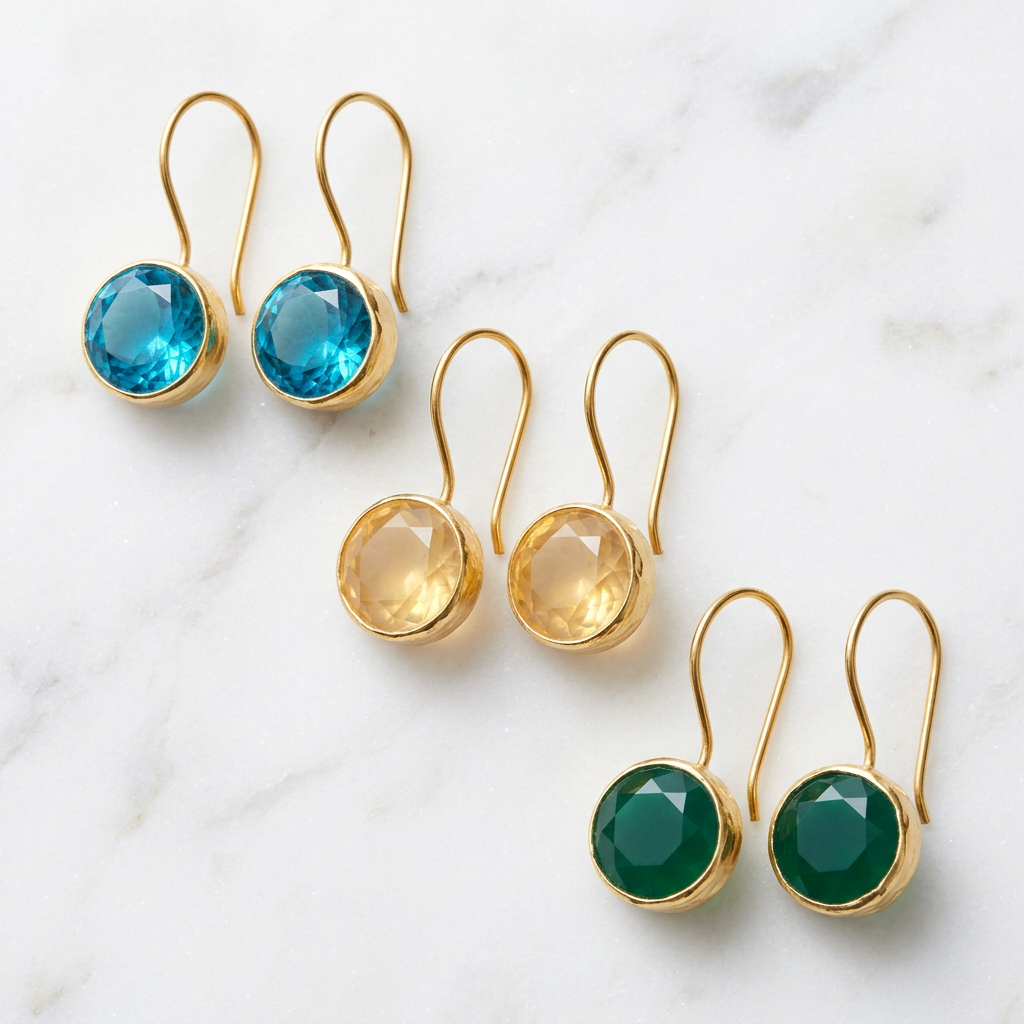 Minimalist gold faceted stone drop earrings in blue, champagne and green on white marble
