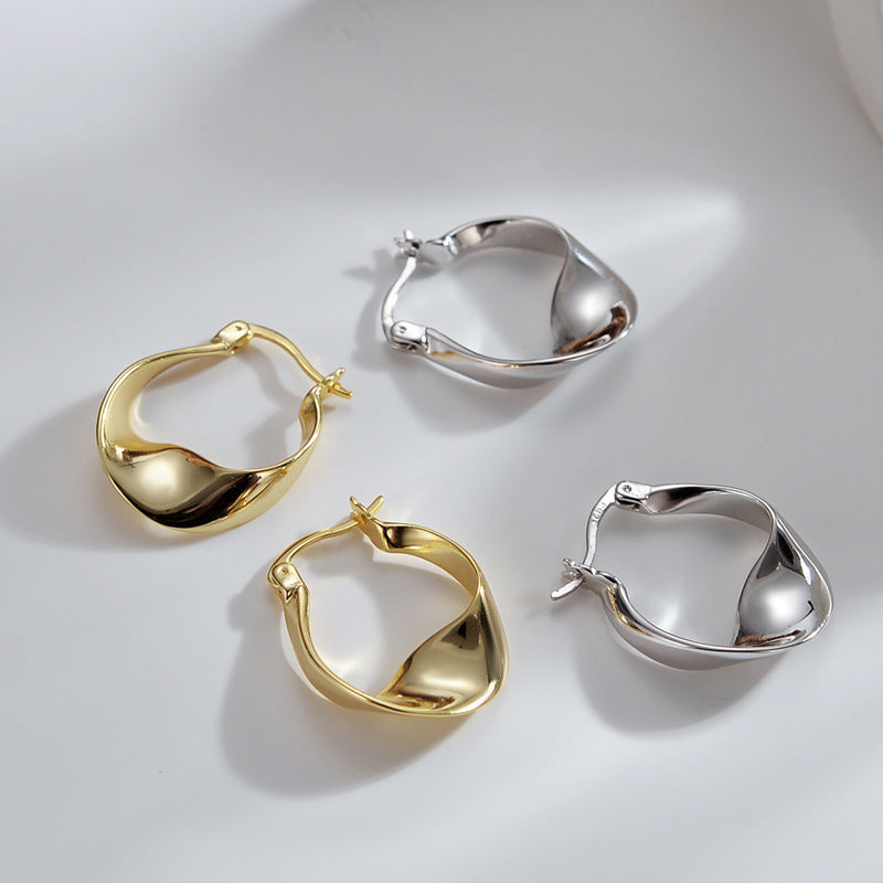 Glossy Twisted Huggie Earring – Silver & Gold Korean Style