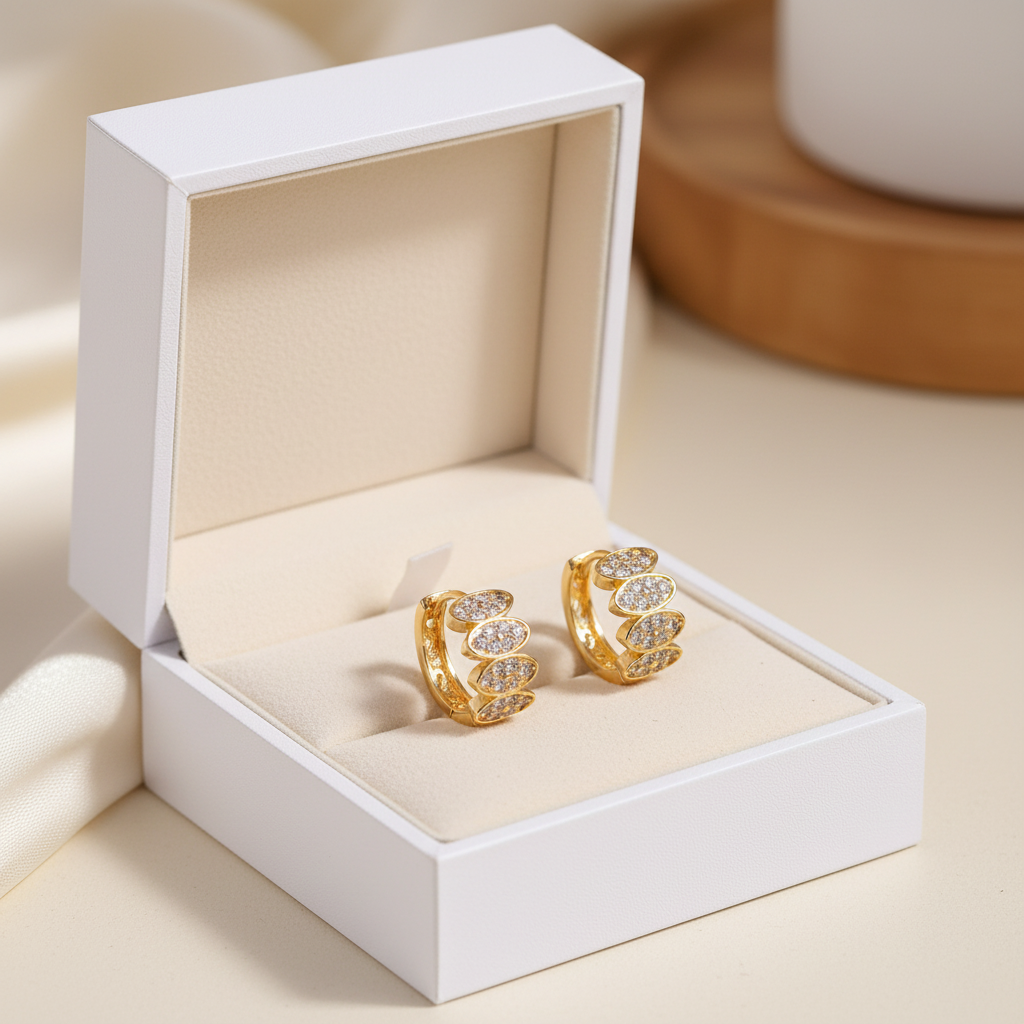 Gold zircon huggie earrings in luxury white jewelry gift box