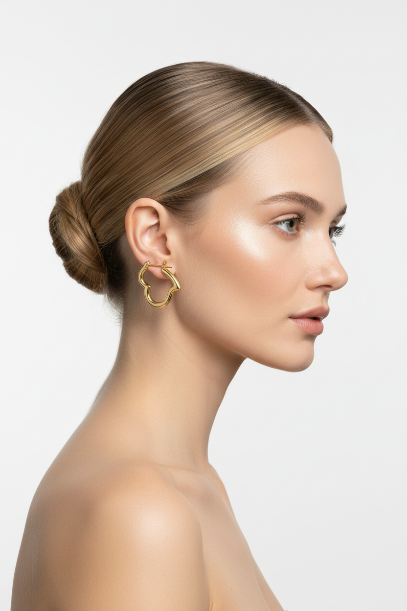 Blonde woman right profile, ballerina bun, Au750 yellow gold heart hoop earrings