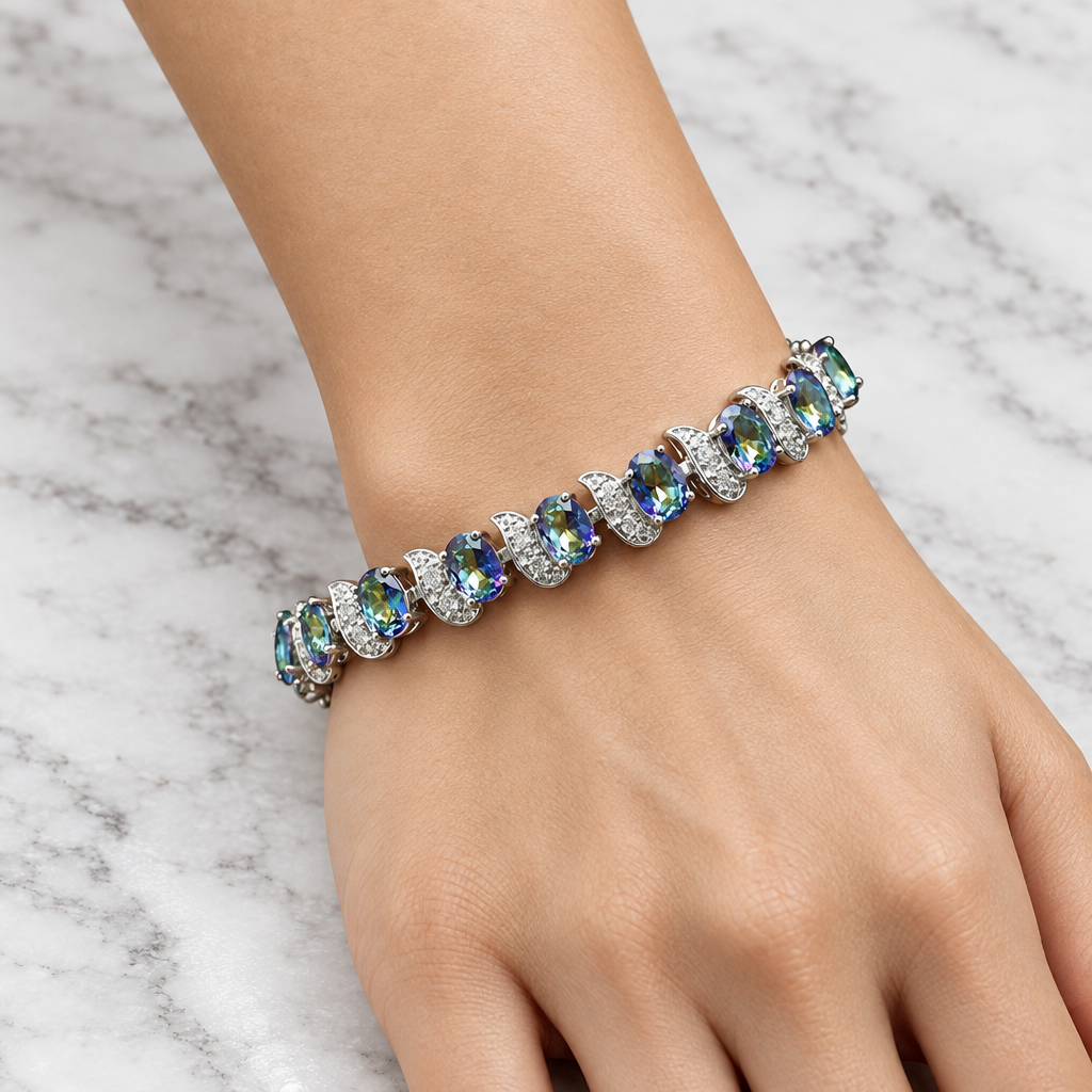 Colourful accent bracelet on a woman's wrist resting on marble