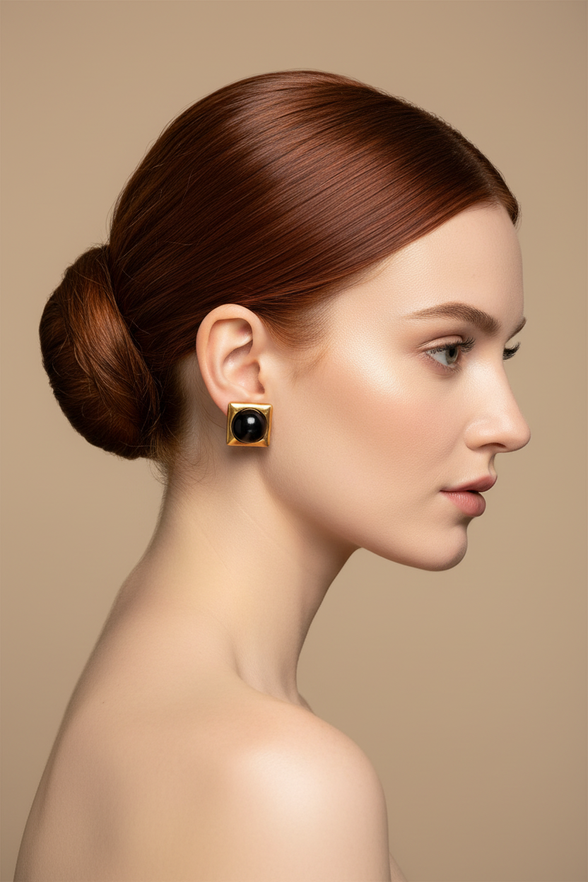 Redhead woman right profile, ballerina bun, square black agate gold stud earrings