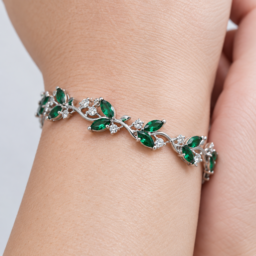 Side-angle close-up of a green stone botanical bracelet worn on a woman's wrist