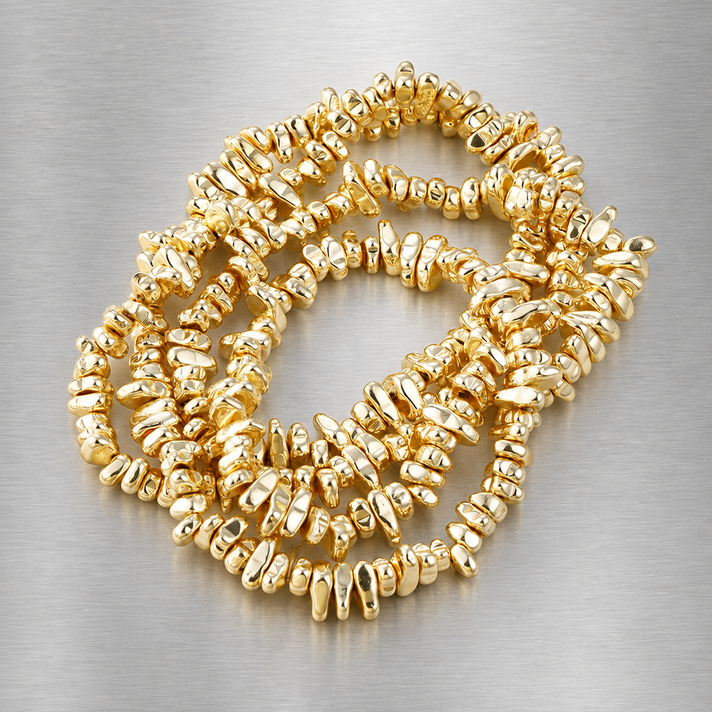 Gold-tone irregular bead bracelet on brushed steel