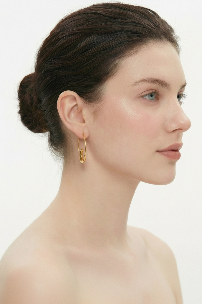 Woman profile, ballerina bun, gold hoop earrings