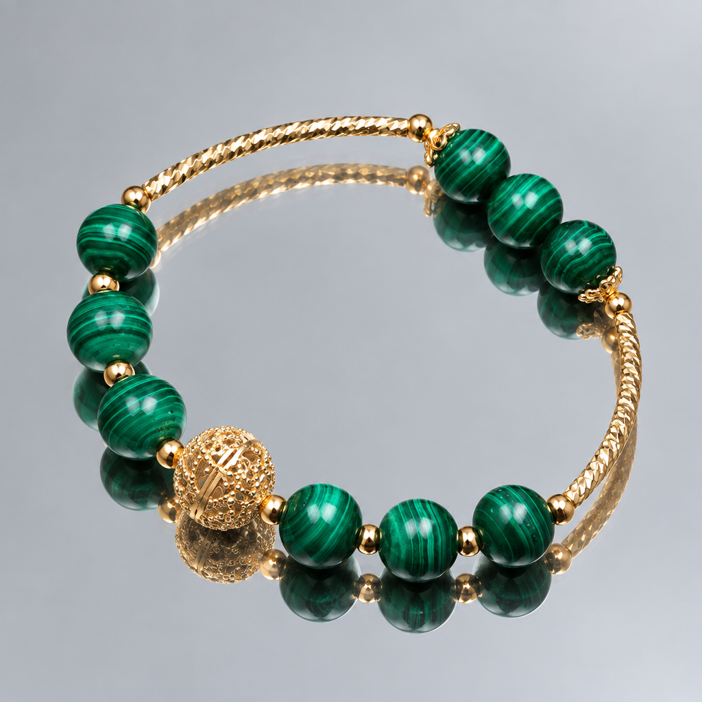 Malachite bead bracelet with gold-plated details on a mirror