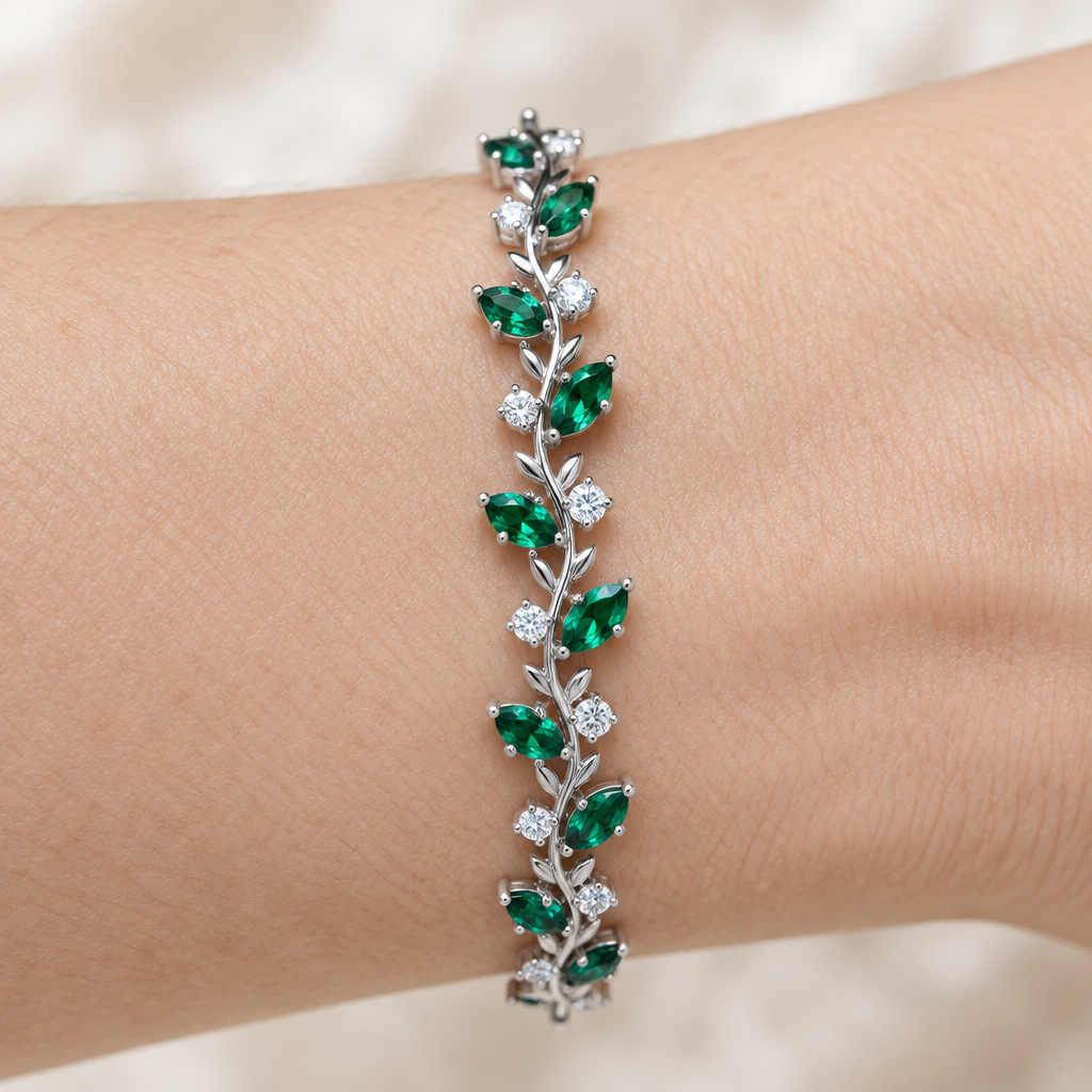 Top-down macro close-up of a green stone botanical bracelet on a woman's wrist