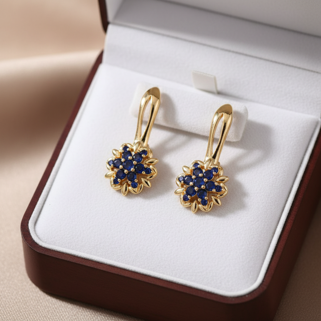 Gold sapphire sunflower drop earrings in luxury jewelry box