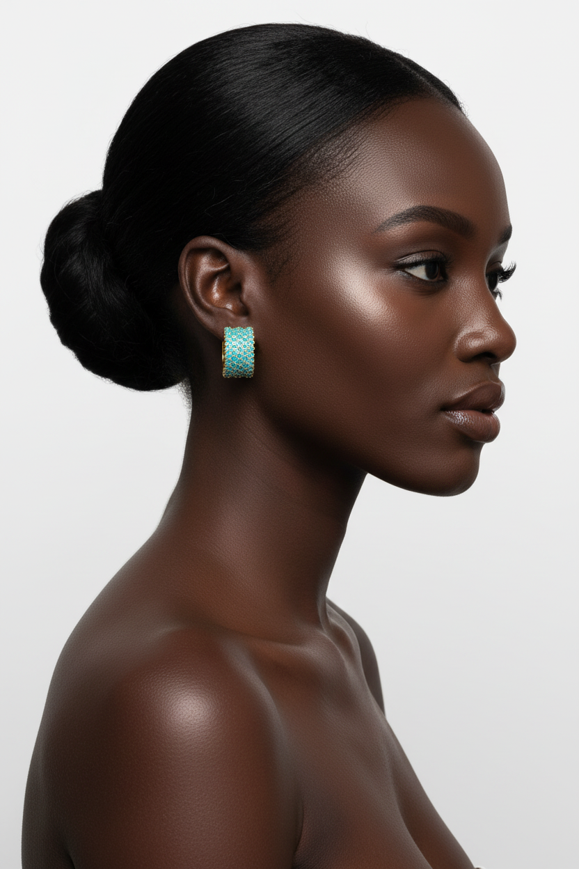 Zulu woman right profile, updo bun, turquoise pavé wide band gold hoop earrings