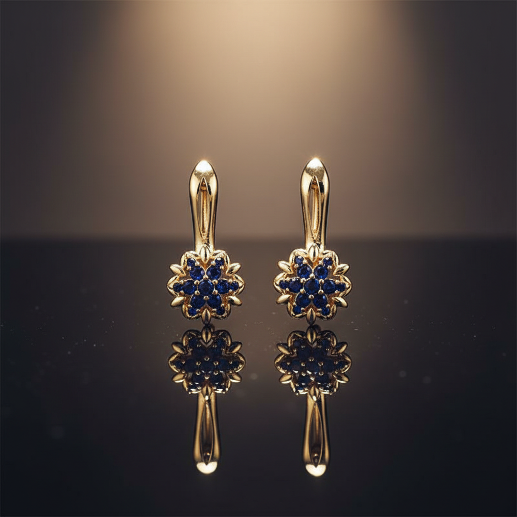 Gold sapphire sunflower drop earrings on jewelry store counter