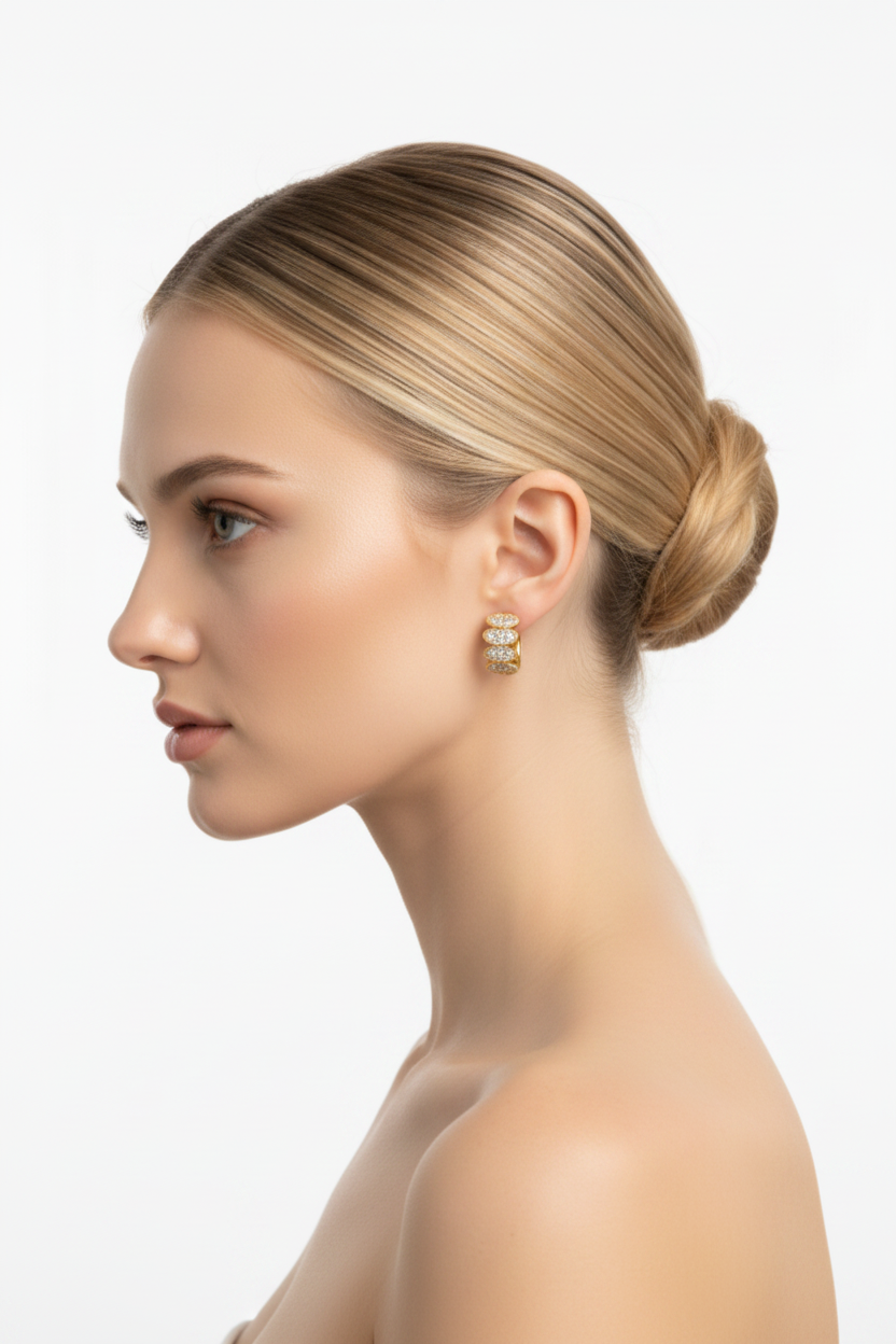 Woman left profile, ballerina bun, small gold floral cluster huggie earring