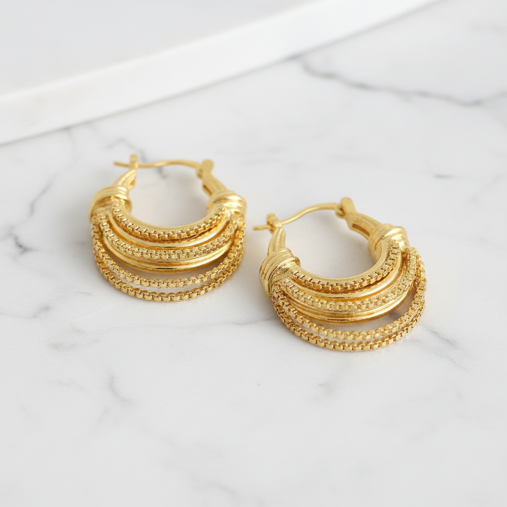 Gold Layered Hoop Earrings on White Marble